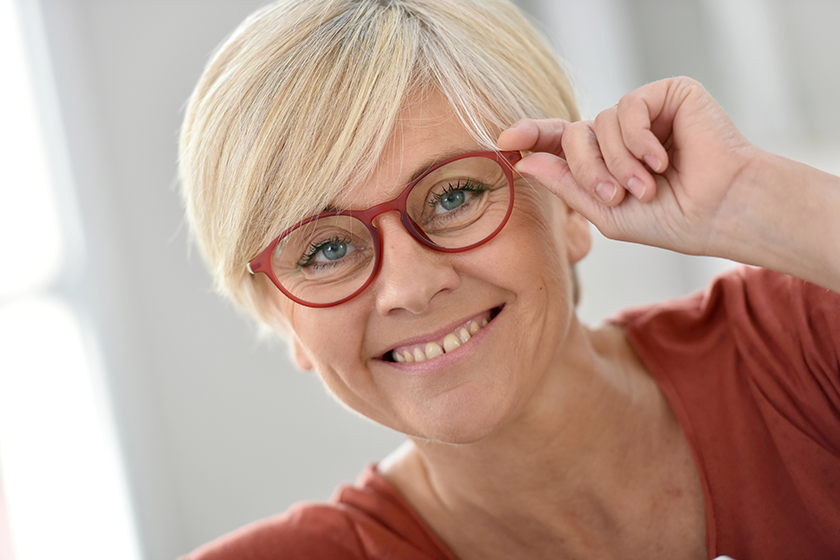 Senior woman with eyeglasses on 